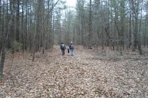 Ryan Knopf and Wes carry out a tire dumped in the Deep Run Ponds Preserve during a Headwaters Chapter trip in February 2014.